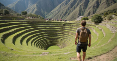Backpacker exploring circular Inca ruins in Moray, Peru