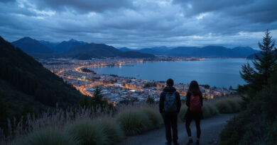 Backpackers viewing evening cityscape of Puerto Varas, Chile