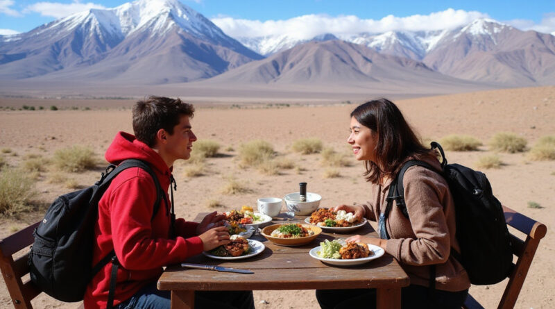 Backpackers dining at מסעדות בסן פדרו דה אטקמה צ'ילה with Andean peaks view