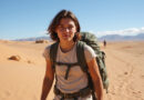 Young adult backpacking during טרקים בנאסקה פרו in Nasca desert region
