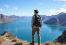 Backpacker overlooking Lake Titicaca and Andean mountains in Peru