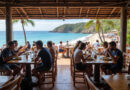 Backpackers enjoying meal at Latin American restaurant in Mancora, Peru