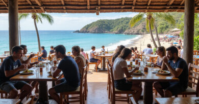 Backpackers enjoying meal at Latin American restaurant in Mancora, Peru