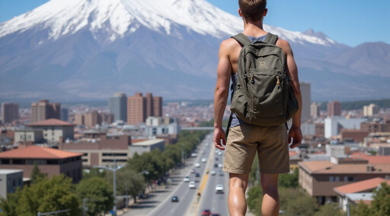 Young man backpacking in Temuco Chile observing cityscape