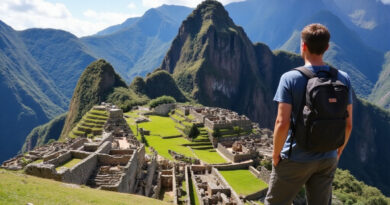 Youthful backpacker at אטרקציות באולנטייטמבו פרו with Incan ruins and mountains